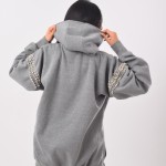 Gray hoodie with diamond straps on the shoulders